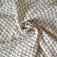 Tissu à relief en double-gaze motif géométrique