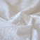 Tissu broderie anglaise blanc fleurs losanges coton 
