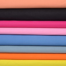 Tissu coton jaune 025, orange 026, gris 014, lavande 022, rose 006, fushia 007, noir 009 et pêche 035 
