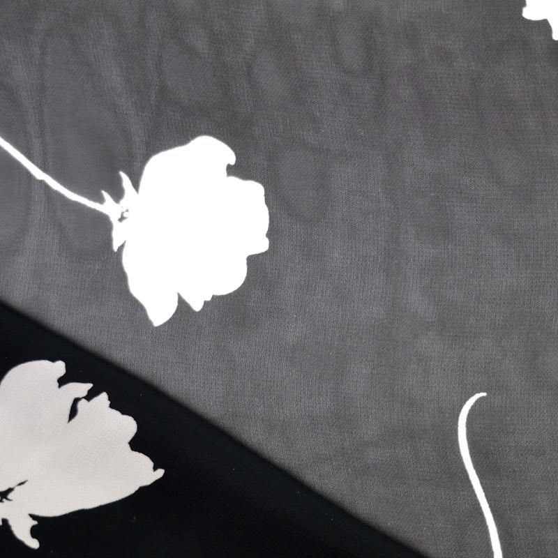 Tissu noir à fleurs blanche voile polyester transparent - A&A Patrons